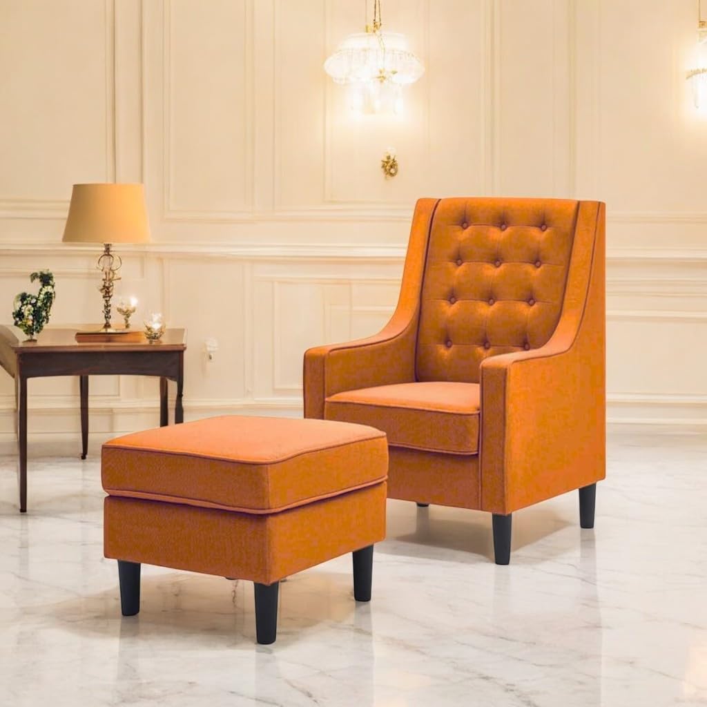 Orange armchair and ottoman in a stylish room with decorative elements.