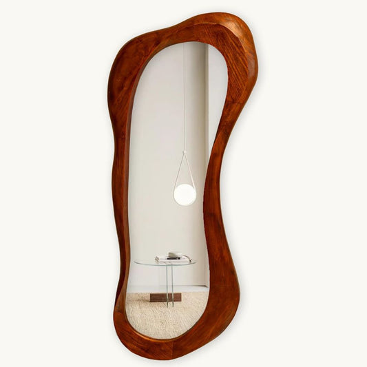 Wooden wall mirror with wavy design on a white background
