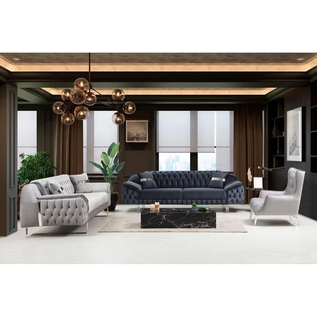 Modern living room with gray and blue sofas, a coffee table, and decorative elements.