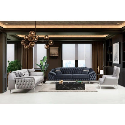 Modern living room with gray and blue sofas, a coffee table, and decorative elements.