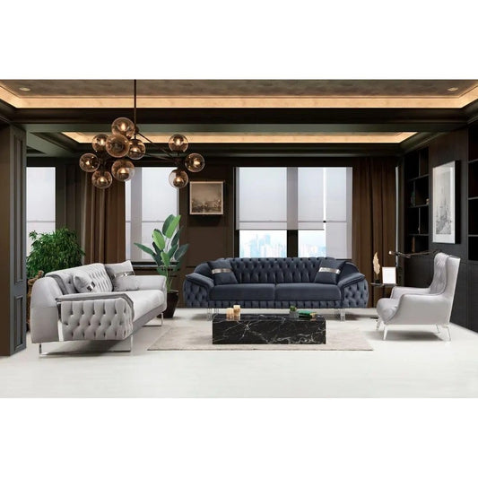 Modern living room with gray and blue sofas, a coffee table, and decorative elements.