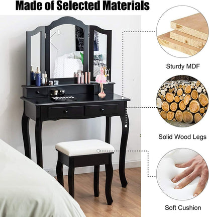 Black vanity table with mirror, stool, and cosmetic items on a wooden floor.