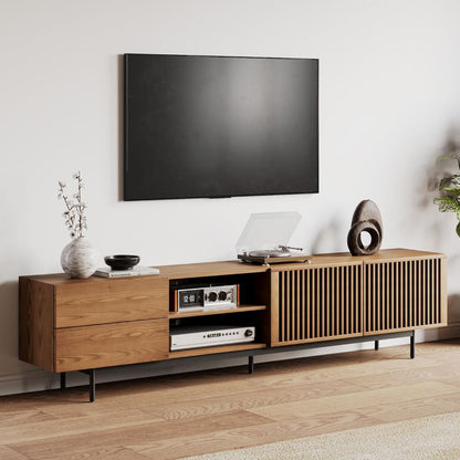 Wooden TV stand with a television mounted above it in a living room setting.