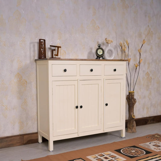White cabinet with wooden top against a patterned wall