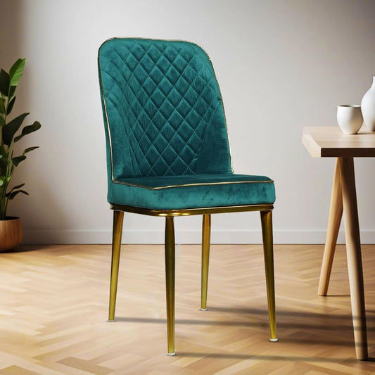 Teal velvet chair with gold legs in a room setting