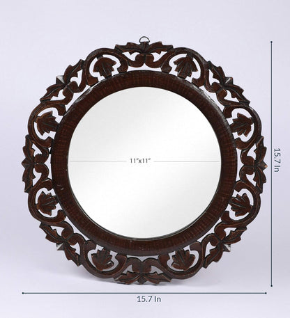 Decorative round mirror with intricate carvings and dimensions on a white background