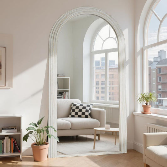 Living room with a large arched mirror reflecting a cityscape