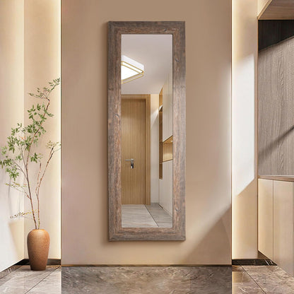 Wooden-framed mirror on a wall in a modern interior setting