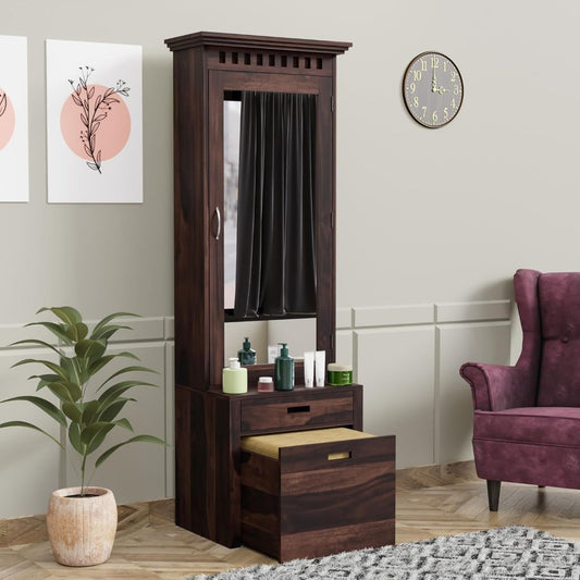 Wooden hall stand with mirror and drawers in a room with a clock, plant, and chair.