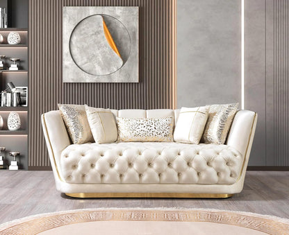 Beige tufted sofa with decorative pillows in a stylish room.