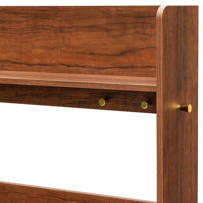 Wooden headboard with gold knobs on a white background