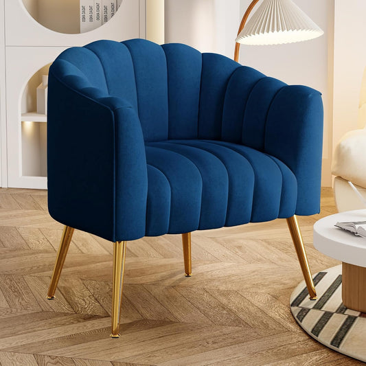 Blue armchair with gold legs in a room setting