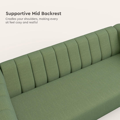 Green sofa with supportive mid backrest on a white background