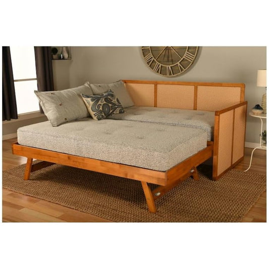 Wooden daybed with gray cushion in a room setting