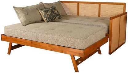Wooden daybed with beige cushion and woven backrest on a white background