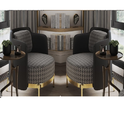 Two modern armchairs with patterned cushions and gold legs in a room setting.