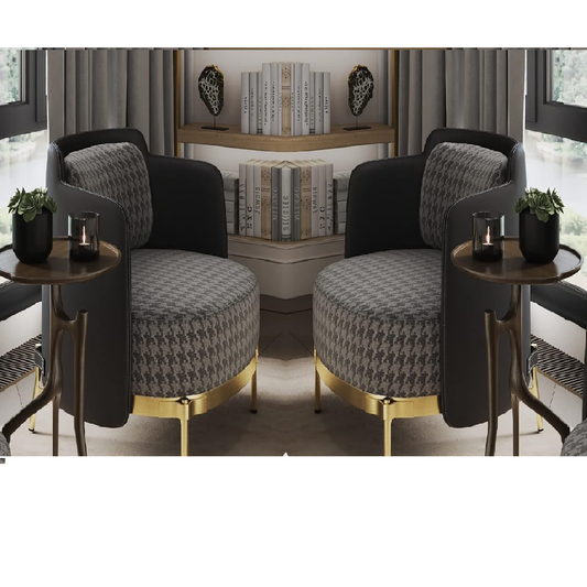 Two modern armchairs with patterned cushions and gold legs in a room setting.