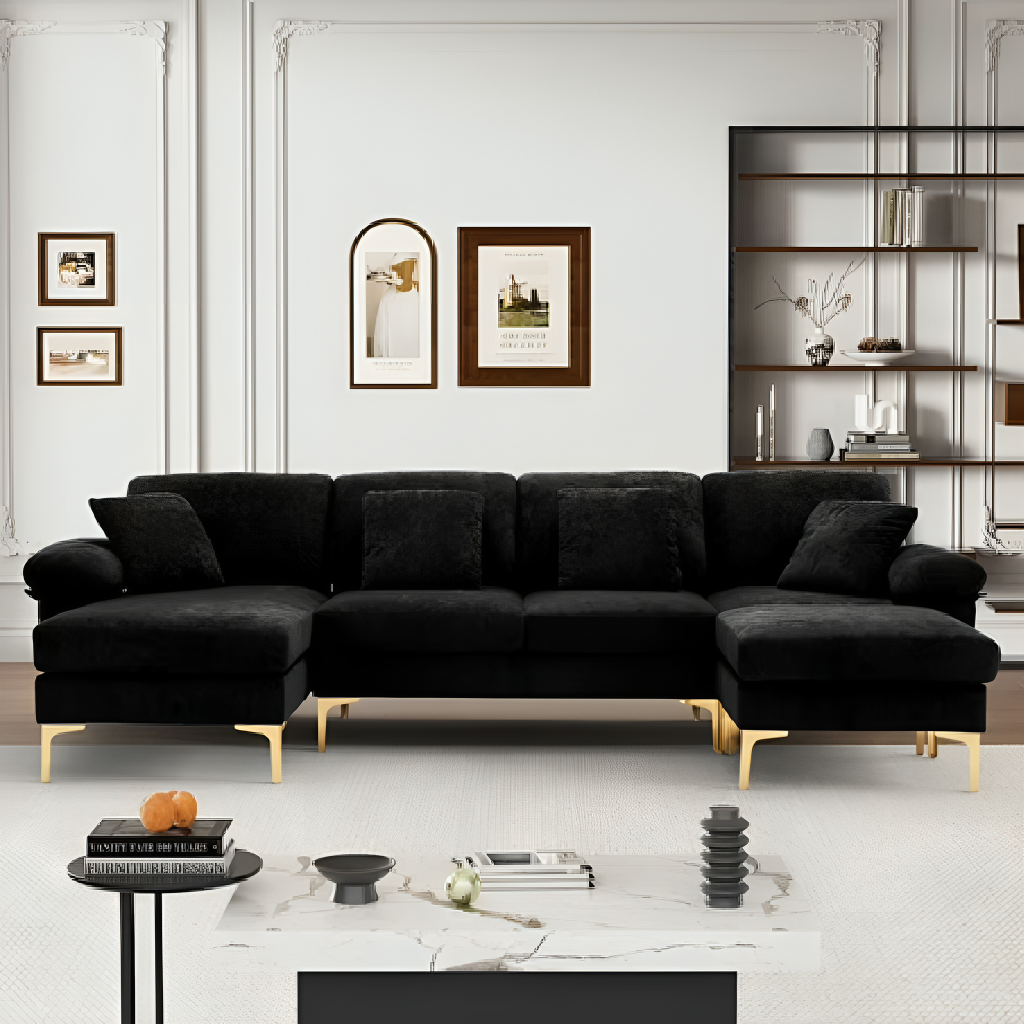 Black sectional sofa in a modern living room with decor elements.
