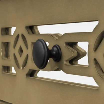 Close-up of a mechanical device with a black knob on a beige background