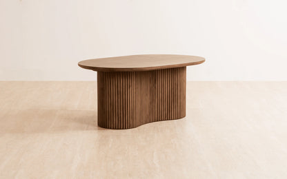 Wooden coffee table on a beige background