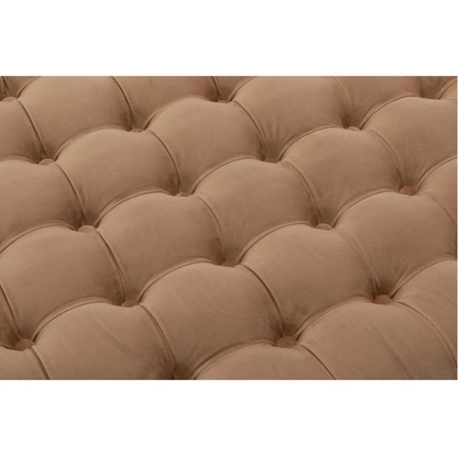 Close-up of a tufted brown cushion on a white background