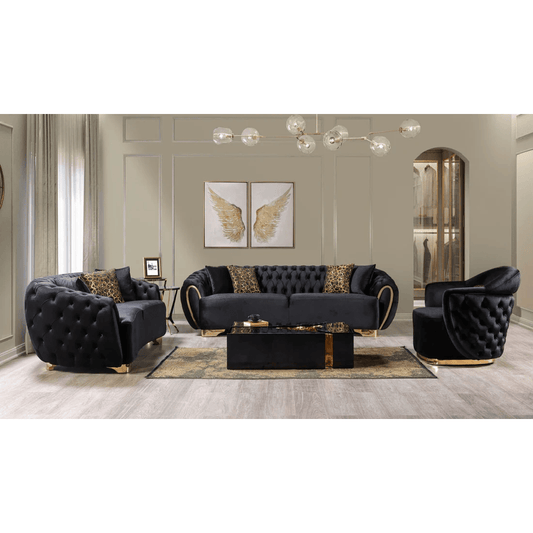 Modern living room with black tufted sofa set and decorative elements.