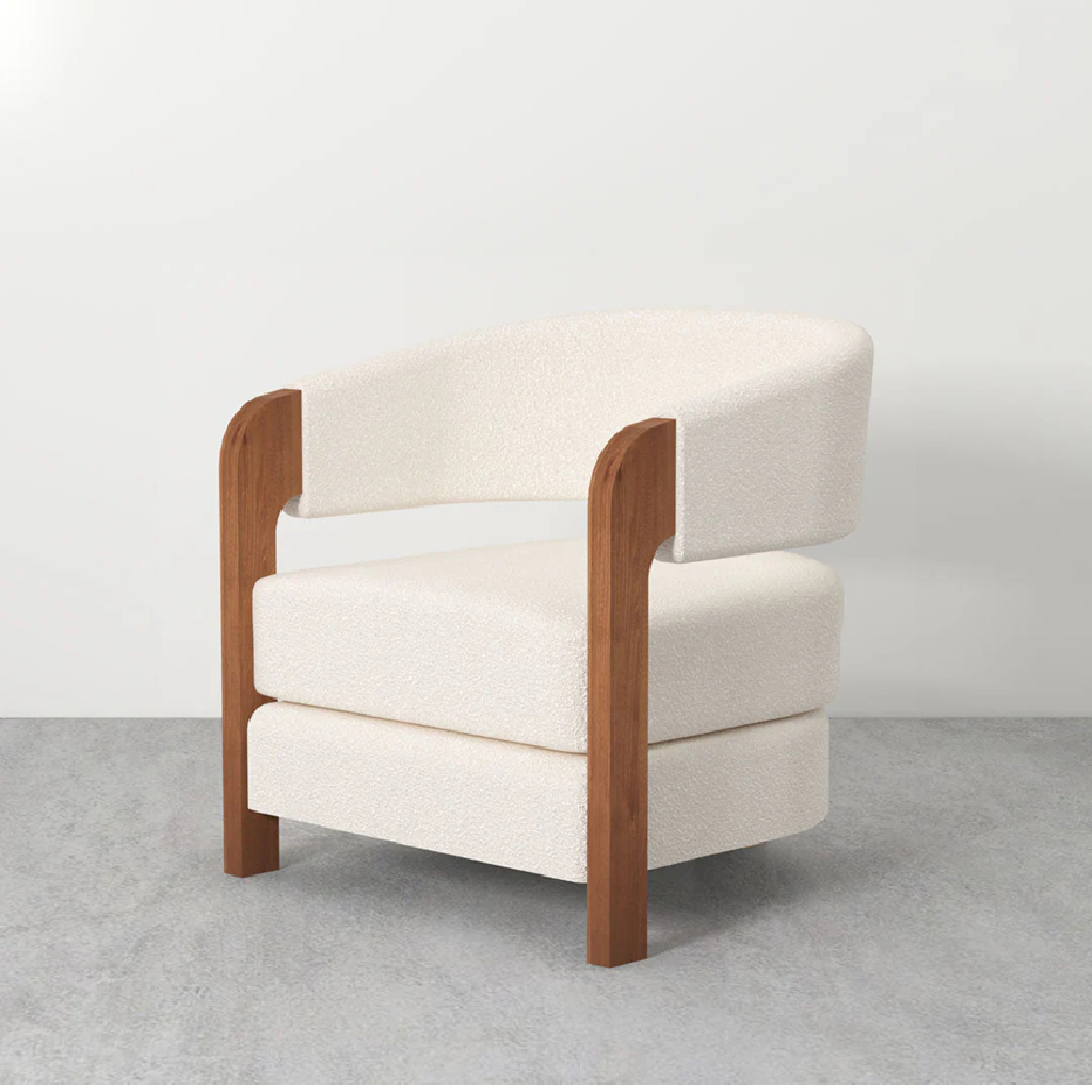 White armchair with wooden frame on a gray floor and white background