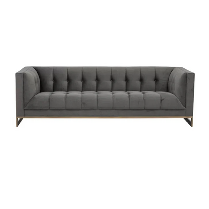 Gray tufted sofa on a white background