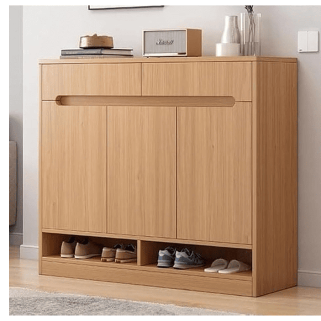 Wooden shoe cabinet with open doors showing shoes inside, placed against a white wall.