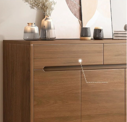 Wooden sideboard with decorative items on a neutral background