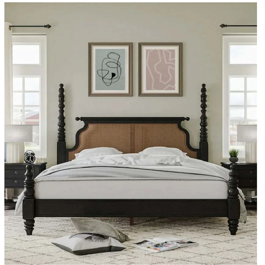 Bedroom with a wooden bed frame, white bedding, and abstract art on the wall.