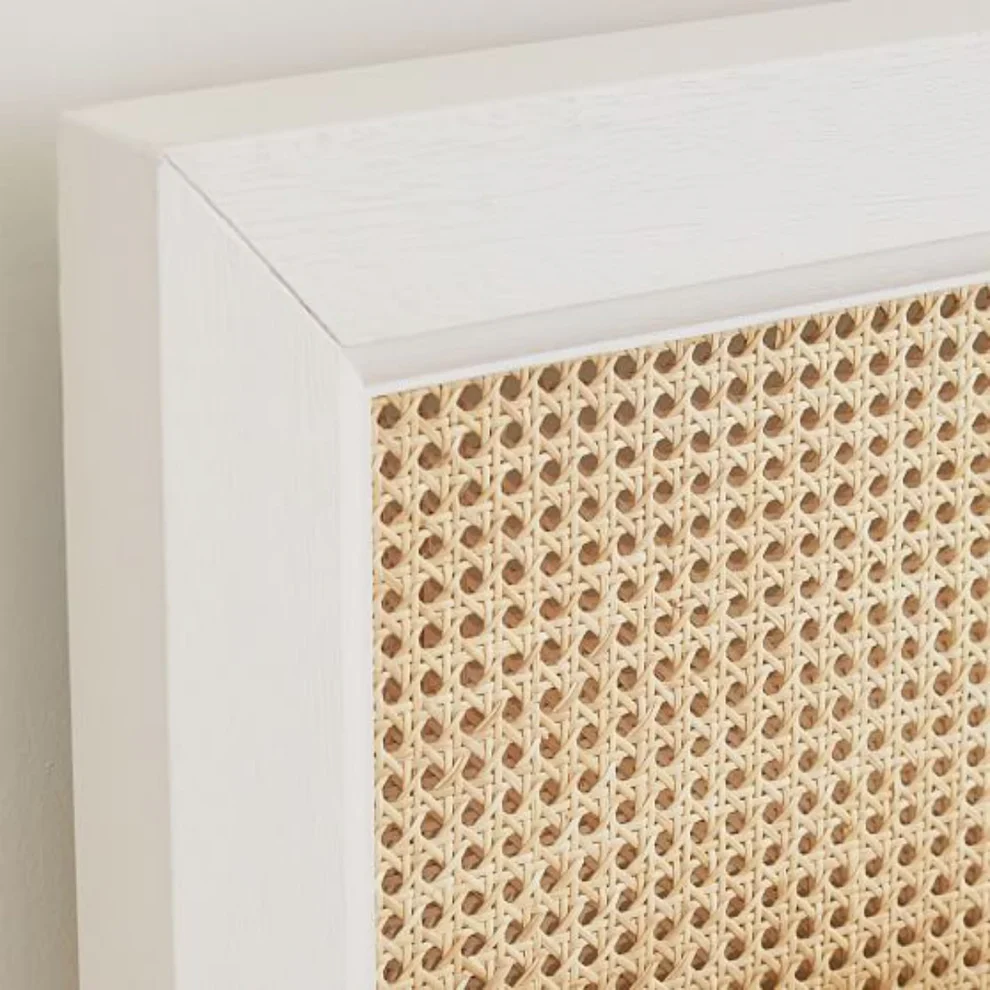 Close-up of a textured wall panel with a white frame.
