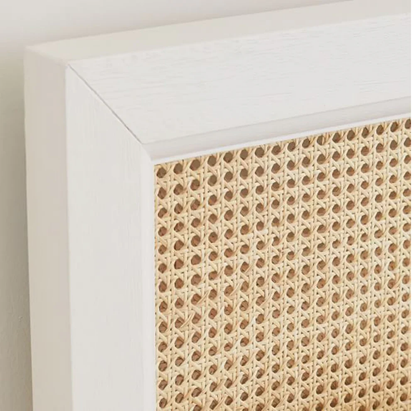 Close-up of a textured wall panel with a white frame.