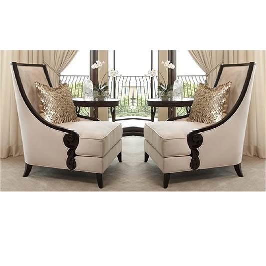 Two ornate chairs with decorative cushions in a room with curtains and a table.