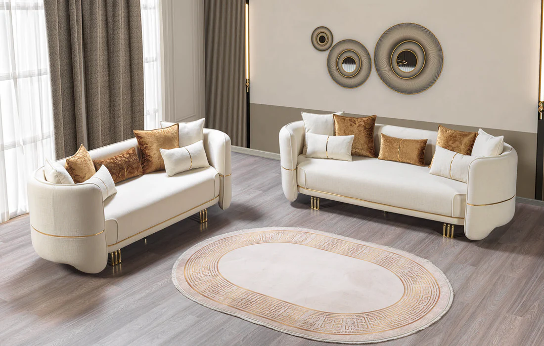 Two beige sofas with decorative pillows in a stylish living room.
