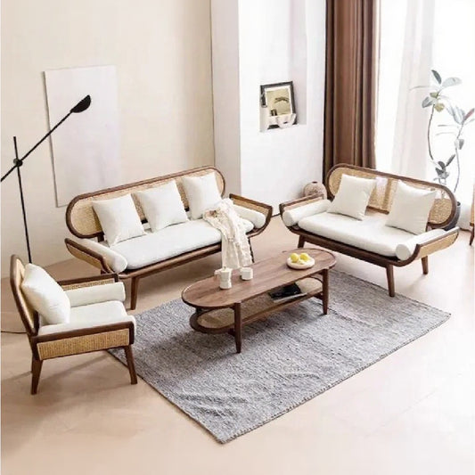 Modern living room with wicker furniture and a wooden coffee table.