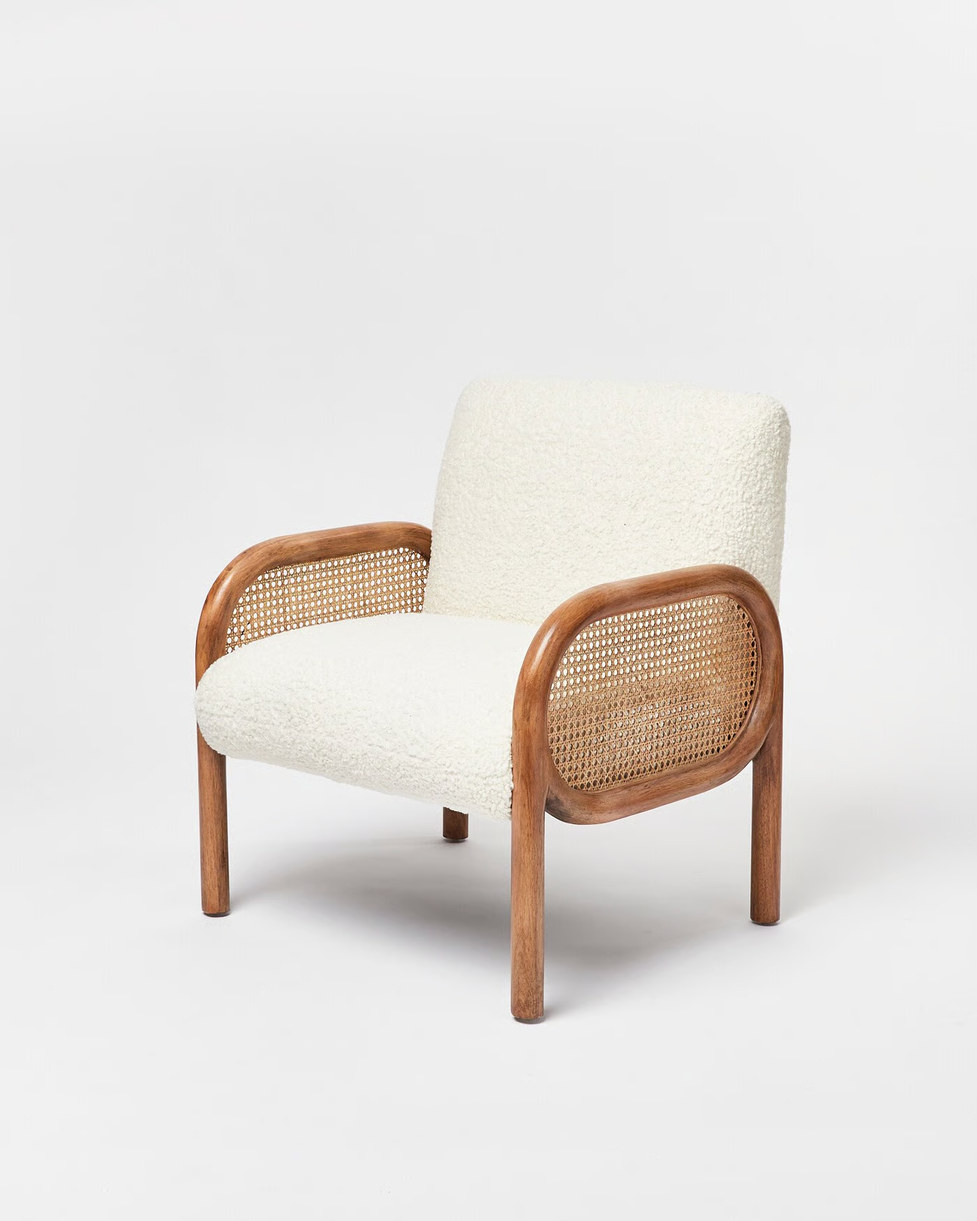 Chair with white cushion and wooden frame on a white background