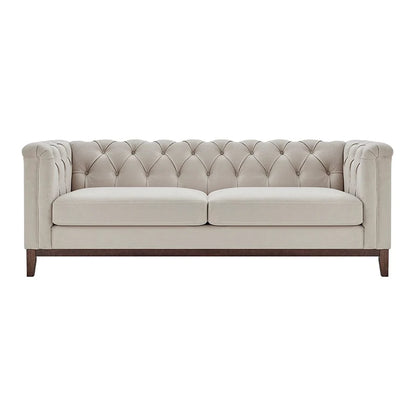 Beige tufted sofa on a white background