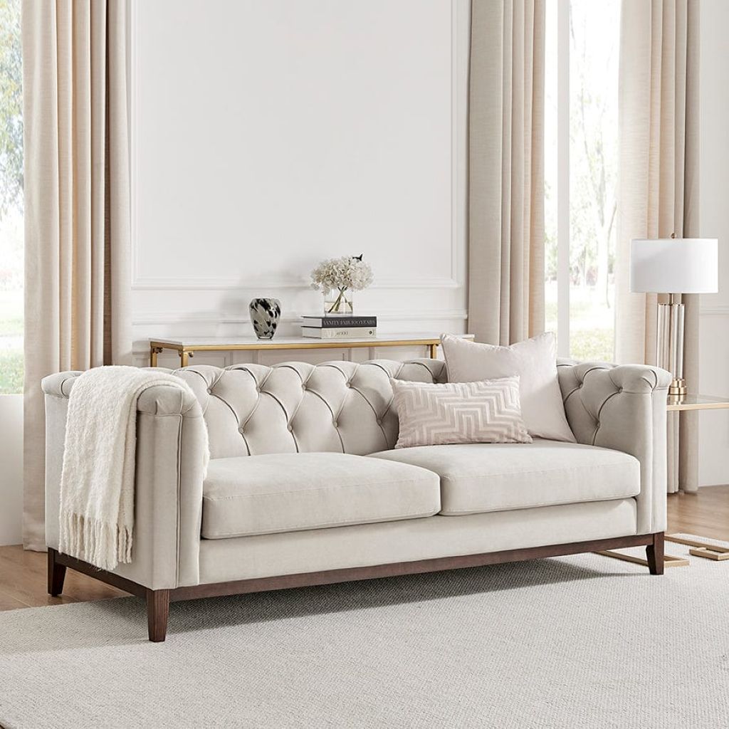 Beige sofa in a living room with neutral decor
