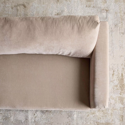 Beige fabric roll on a textured stone background