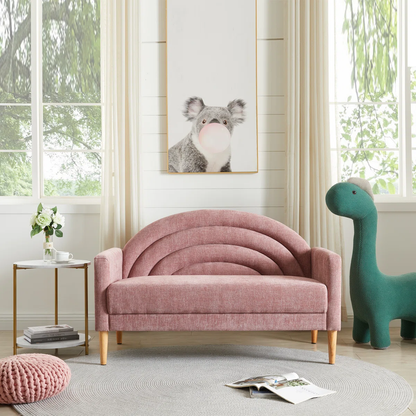 Pink children's sofa in a room with a dinosaur toy and a koala painting on the wall.