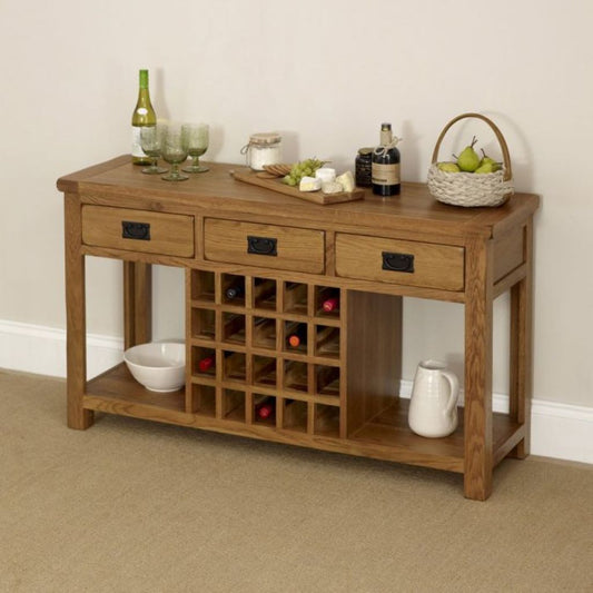Wooden console table with wine rack and various items on a beige carpeted floor.