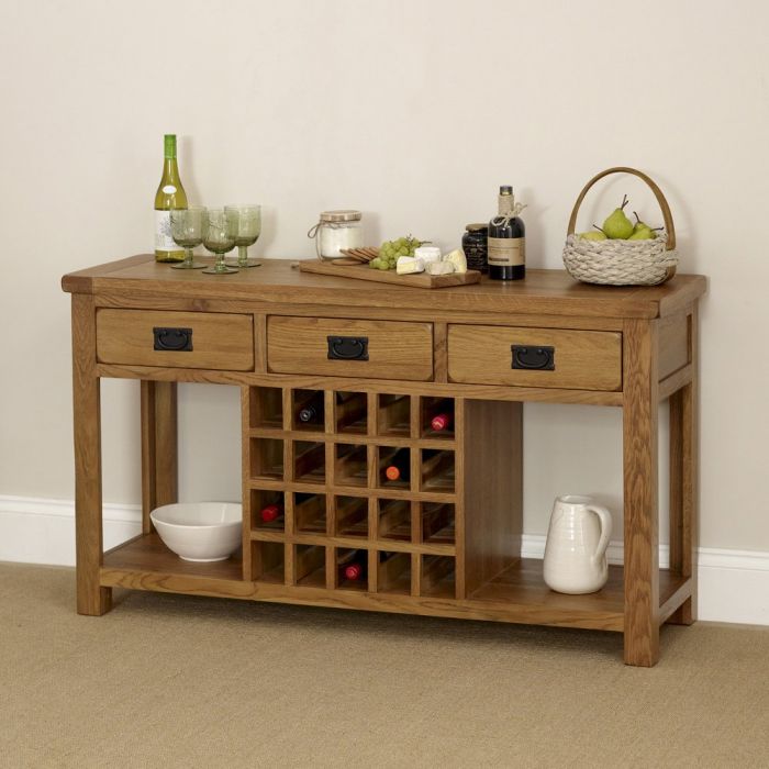 Wooden console table with wine storage against a beige wall