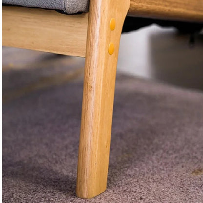 Close-up of a wooden chair leg with a blurred background