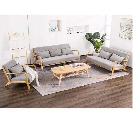 Modern living room with gray sofas, armchair, and coffee table on a wooden floor.