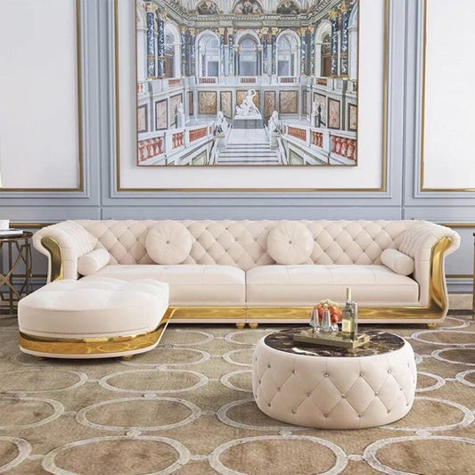Luxurious living room with a white tufted sofa, matching ottoman, and coffee table.
