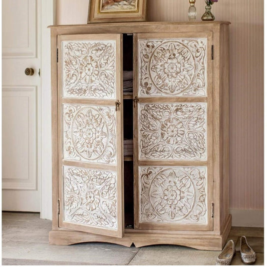 Wooden cabinet with decorative carvings in a room setting