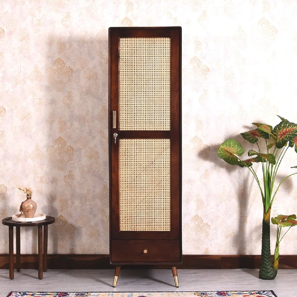 Wooden screen with wicker design in a room setting with a small table and plant.